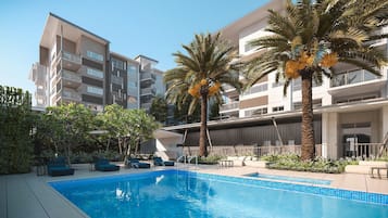 Outdoor pool, pool umbrellas, sun loungers