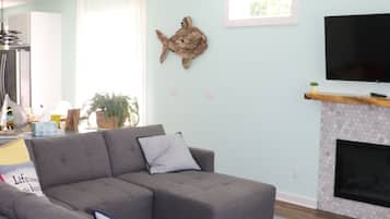 Smart TV, fireplace, foosball, books