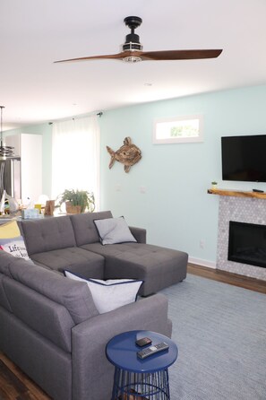 Smart TV, fireplace, table football, books