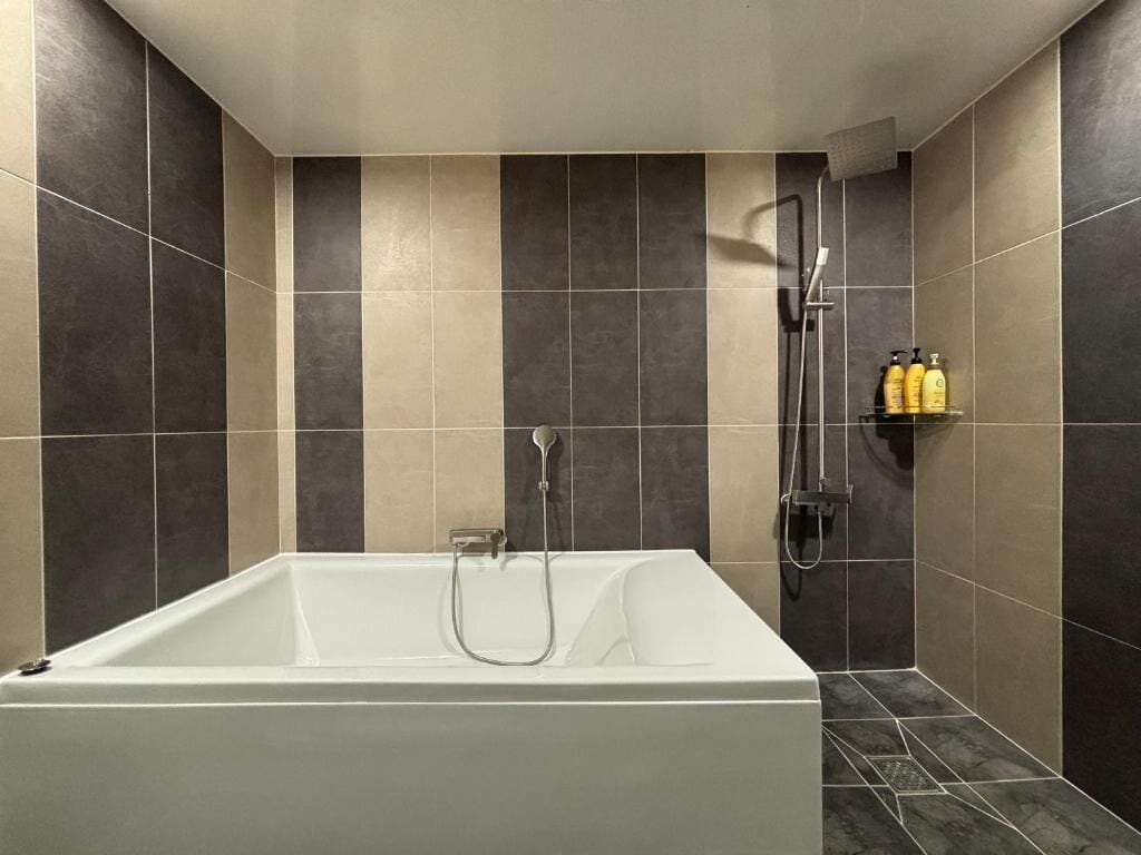 Suite, Jetted Tub | Bathroom | Free toiletries, hair dryer, bathrobes, slippers