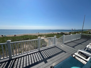 A deck with a view of the beach and ocean. - Gorgeous and Unique New England Beach House: Panoramic Views of Saco Bay! (Saco)