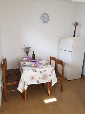 Apartment (A1) | Private kitchen | Fridge, oven, stovetop, electric kettle - Apartment Lavcevic (Jelsa)