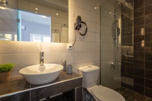 Double Room | Bathroom | Shower, hair dryer, bathrobes, towels - Ionian City by Checkin (Corfu)