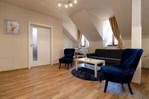 Apartment, 1 Bedroom, Kitchenette, River View (2) | Living area | Flat-screen TV - Apartments Menuet (Karlovy Vary)