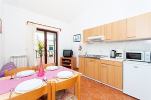 Apartment (A2) | Private kitchen | Fridge, stovetop, espresso maker, cookware/dishes/utensils - Apartments Luciana (Rovinj)