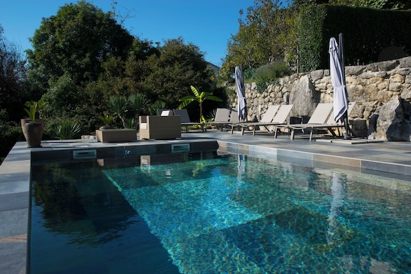 Outdoor pool, pool umbrellas, sun loungers