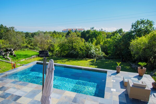 Outdoor pool, pool umbrellas, pool loungers
