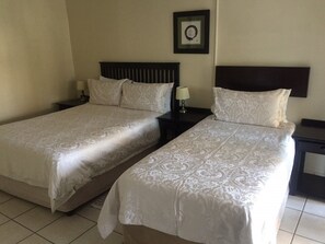 Basic Double Room | Minibar, desk, blackout drapes, iron/ironing board - Toro Guest House (Moses Kotane)