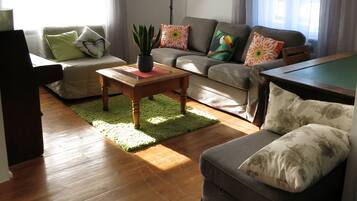 Family Apartment, 1 Bedroom, Garden View, Ground Floor | Living area | Flat-screen TV