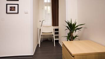 Classic Studio, Garden View | Living area | Flat-screen TV