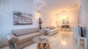 City Apartment, 3 Bedrooms | Living area | Flat-screen TV