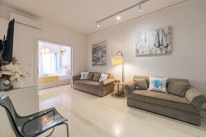 Appartement Ville, 3 chambres | Coin séjour | Télévision à écran plat