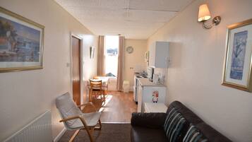 Apartment, 1 Bedroom (Seven) | Iron/ironing board, bed sheets