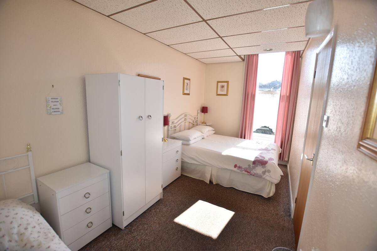 apartment, 1 bedroom, private bathroom | iron/ironing board, bed sheets