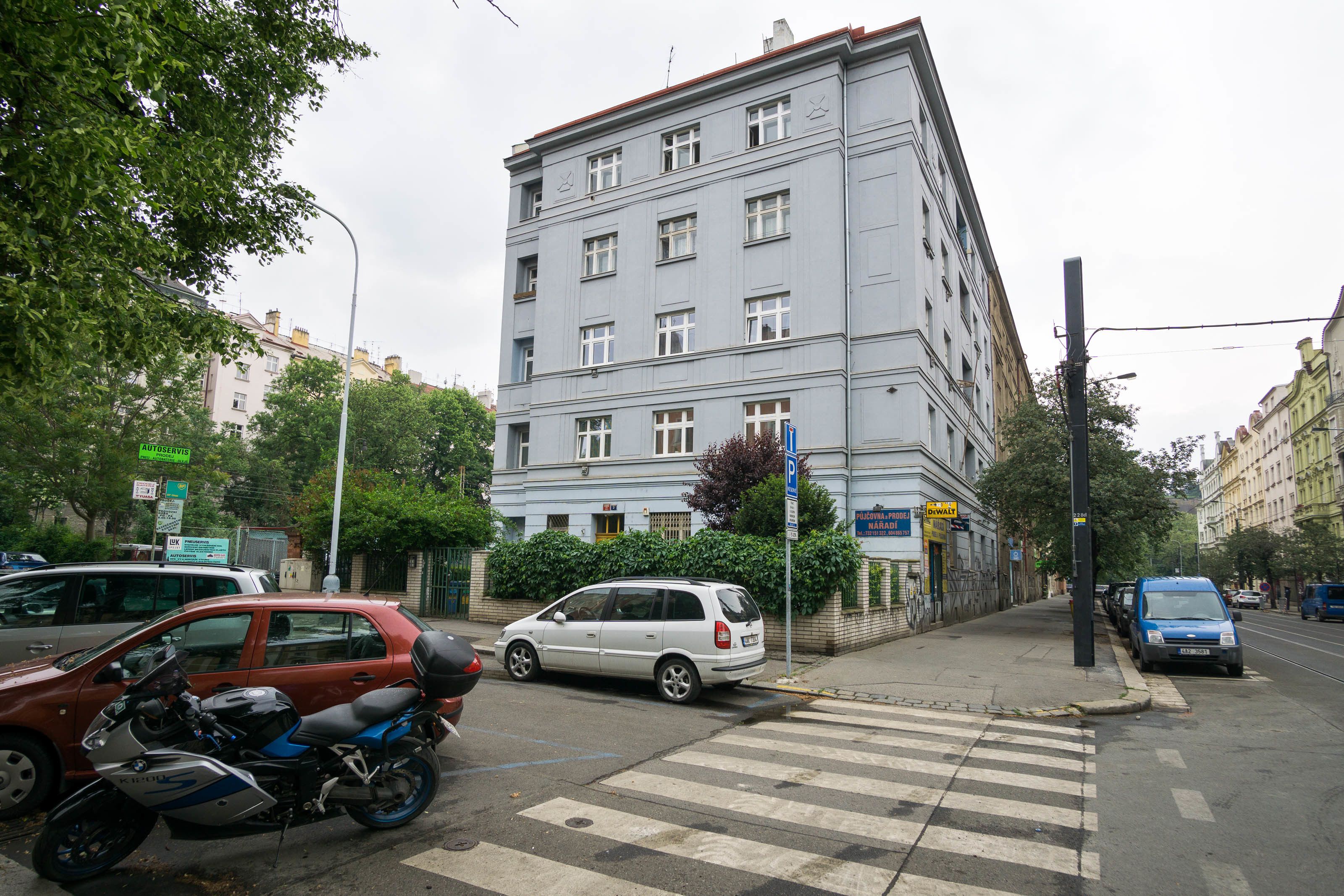 A multi-story building with a flat facade and rectangular windows.
