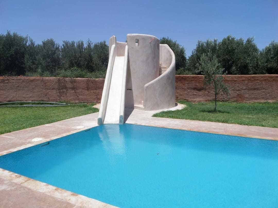 A swimming pool with a slide.