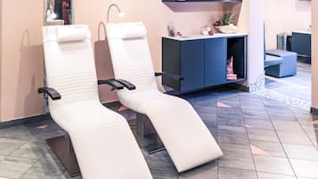 Relax in comfort with adjustable headrests and armrests on our plush chairs, paired with a digital reception desk for convenient guest services.