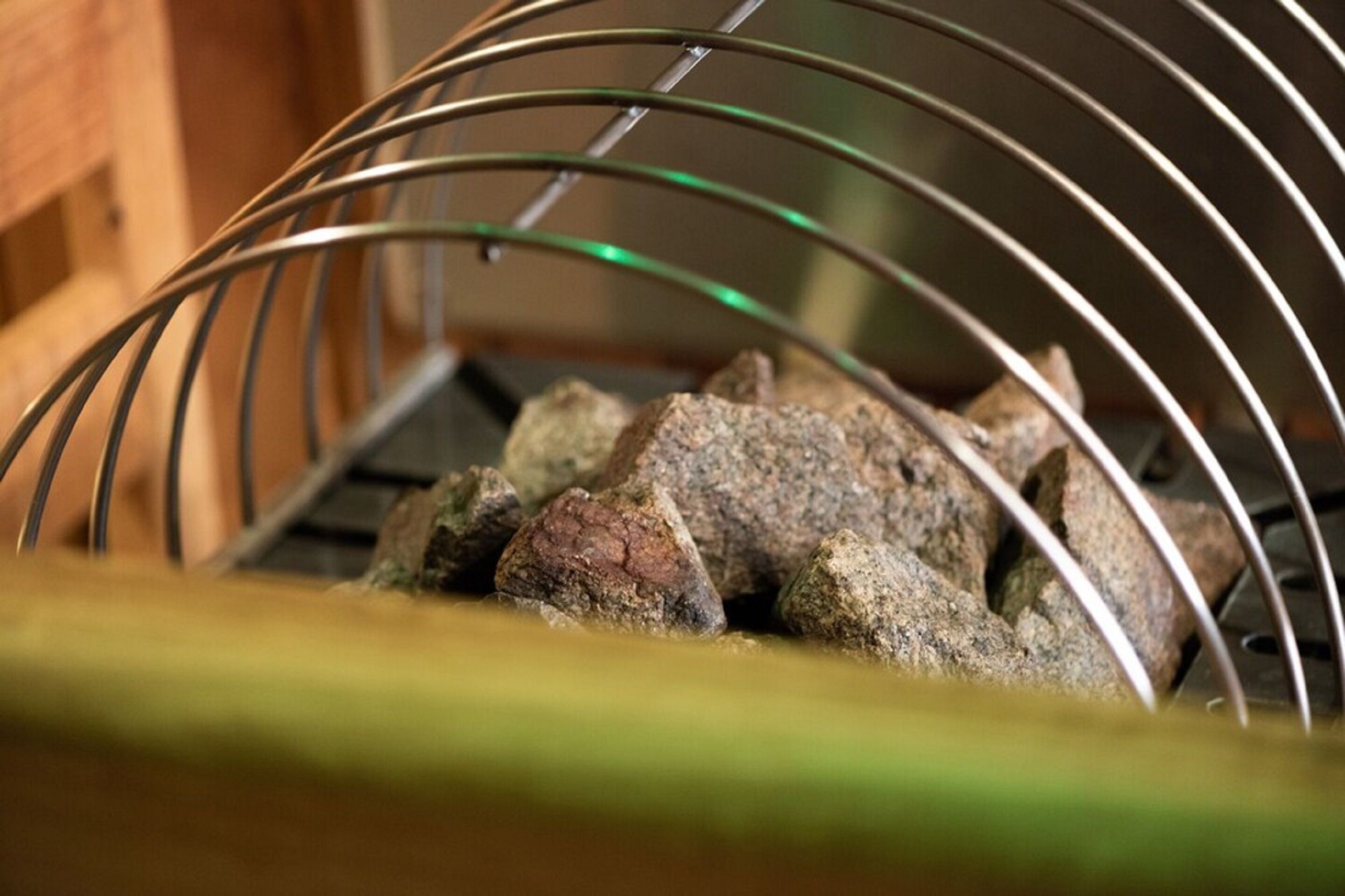 A metal rack with rocks.