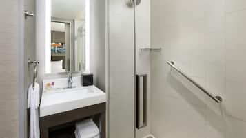 Shower, designer toiletries, hair dryer, towels