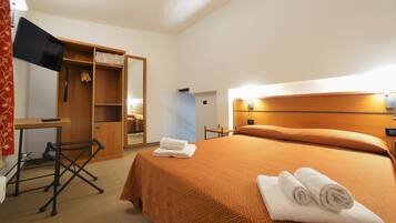 Quadruple Room, Garden View | Minibar, desk, blackout curtains, rollaway beds