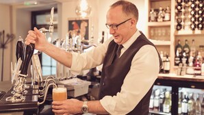 A bartender pouring beer into a glass. - The New Inn - Yealand (Carnforth)