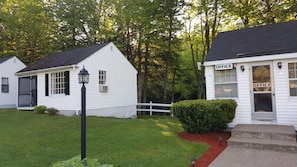 A white building with a sign reading "OFFICE" and the number 572.