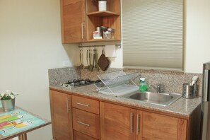 Fridge, stovetop, coffee/tea maker, toaster