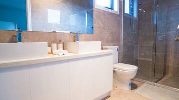 Bathtub, hair dryer, towels, soap