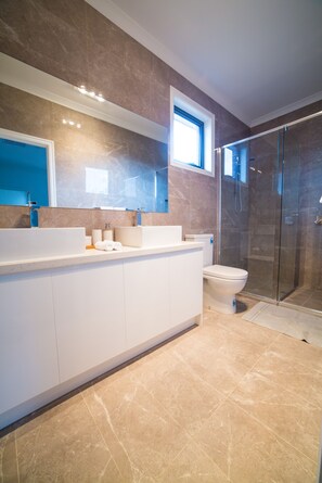 Bathtub, hair dryer, towels, soap