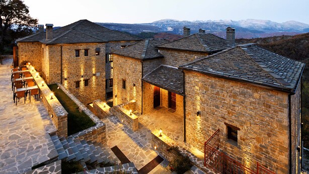 A stone building with multiple rooms and a courtyard. - Hotel Athina (Zagori)