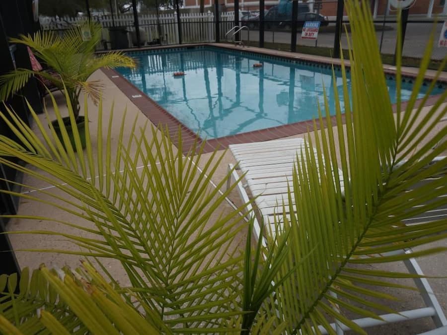 Seasonal outdoor pool, open 9:00 AM to 9:00 PM, pool umbrellas