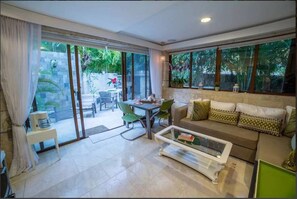 Apartment, 1 Queen Bed with Sofa bed (1 Bathroom - C1-B) | Living room | Flat-screen TV