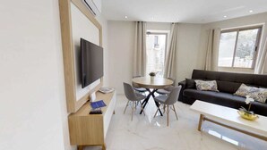 32-inch flat-screen TV with cable channels, TV - The City Residence in Jerusalem (Jerusalem)