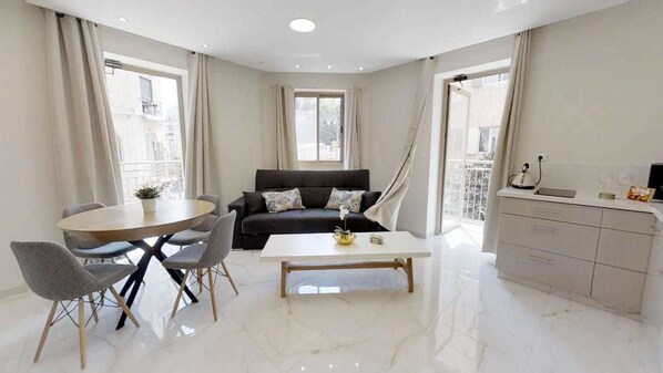 32-inch flat-screen TV with cable channels, TV