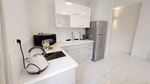 Full-sized fridge, microwave, stovetop, espresso maker