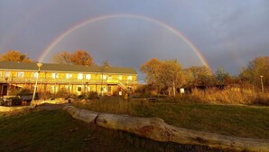 A two-story building with a visible staircase leading to the upper floor. - Amsterdam Farm Lodge: group accommodation (Amsterdam)