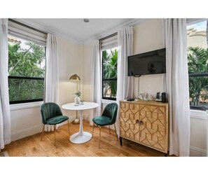 Sunny seating area with TV