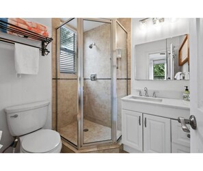 Bathroom with shower and vanity