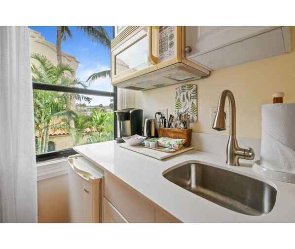 Kitchen sink with tropical view