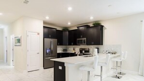 House | Private kitchen | Coffee/tea maker, fridge, microwave, oven - 8BR ChampionsGate Pool Home wTheater (Davenport)