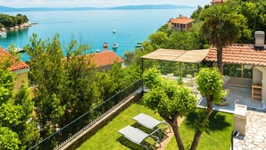 A coastal property with a patio, outdoor seating, and a view of the sea. - Exclusive holiday home in Sveta Marina, Istria, Croatia - right by the sea (Sveta Marina)