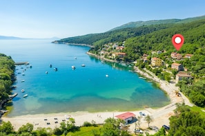 A coastal town with a clear view of the sea, boats, and buildings along the shore. - Exclusive holiday home in Sveta Marina, Istria, Croatia - right by the sea (Sveta Marina)