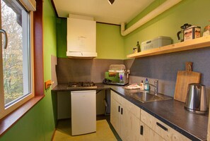 Fridge, microwave, stovetop, coffee/tea maker