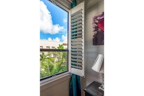Window with leafy courtyard outlook