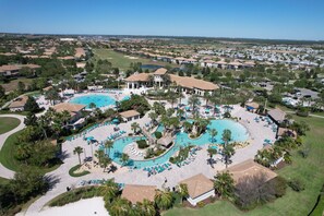 A resort with multiple swimming pools, a golf course, and a large parking area. - Exquisite  9 BEDS POOL HOME ! 15min to Disney World! (Four Corners)