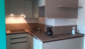 Fridge, coffee/tea maker, toaster, cookware/dishes/utensils