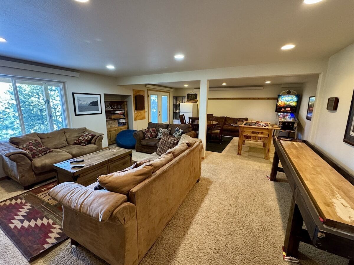 A living room with a sofa, coffee table, and a TV.