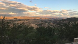 A mountainous landscape with a clear sky and scattered clouds. - Big Bend Bungalow A (TERLINGUA)