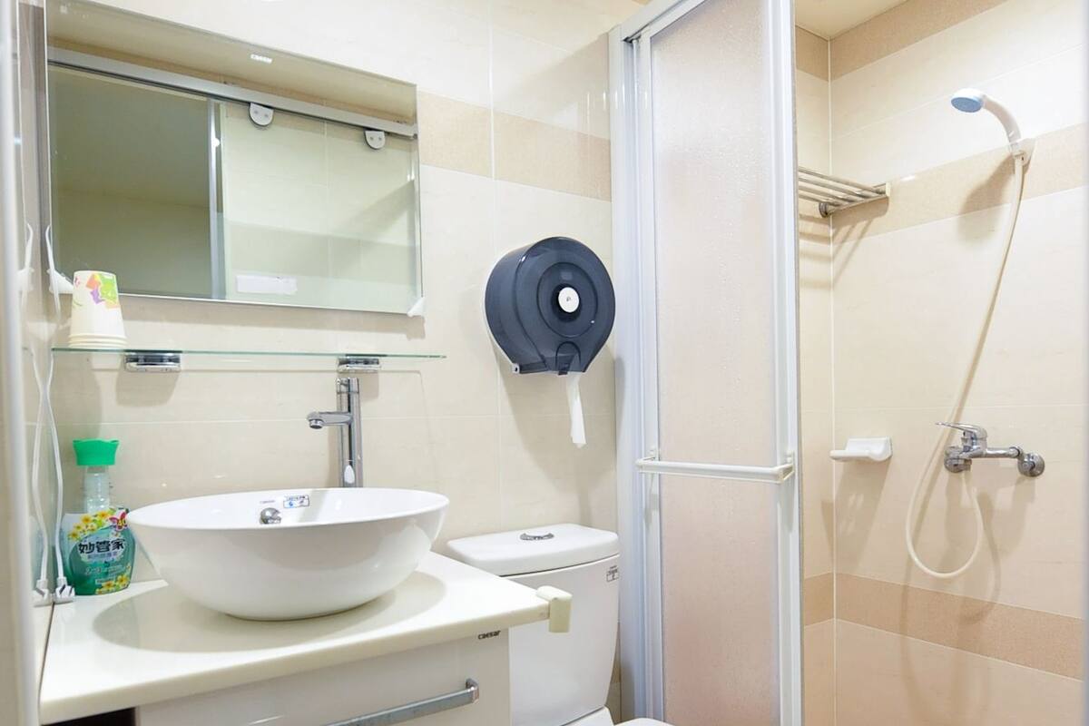 Shower, free toiletries, hair dryer, slippers