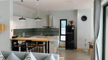 Deluxe Villa | Private kitchen | Full-size fridge, microwave, stovetop, toaster